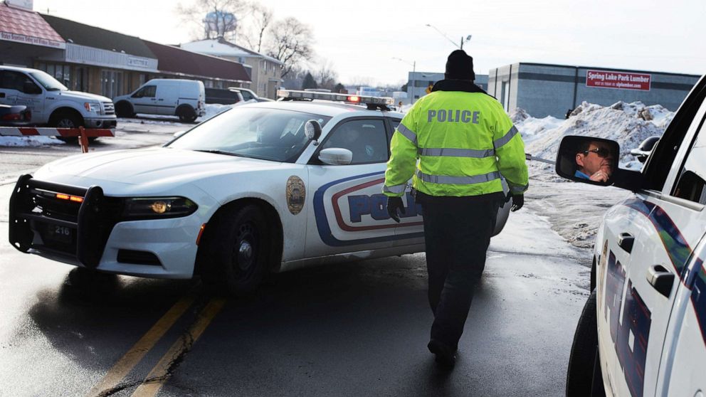 PHOTO: Spring Lake police officers investigate the scene of a shooting in Spring Lake, Minn., Dec. 22, 2019.