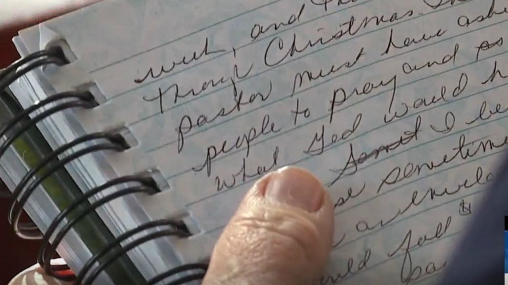 PHOTO: Marsha Hinman of Spencerport, New York, thumbs through a notebook containing a history of her family that was thought lost until a stranger returned just it in time for Christmas, Dec. 24, 2019.