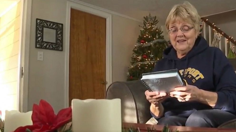 PHOTO: Marsha Hinman of Spencerport, New York, thumbs through a notebook containing a history of her family that was thought lost until a stranger returned just it in time for Christmas, Dec. 24, 2019.