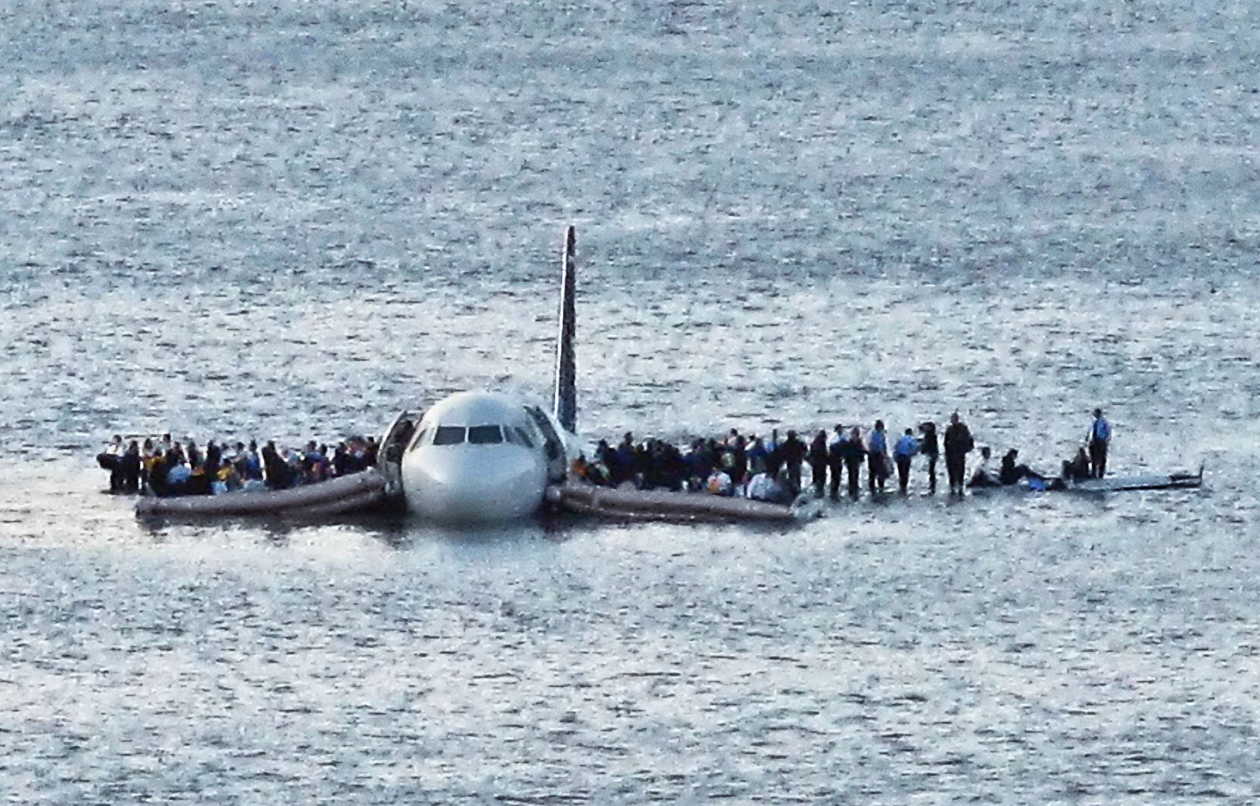 PHOTO: In this Jan. 15, 2009 file photo, airline passengers wait to be rescued on the wings of a US Airways Airbus 320 jetliner that safely ditched in the frigid waters of the Hudson River in New York, after a flock of birds knocked out both its engines.