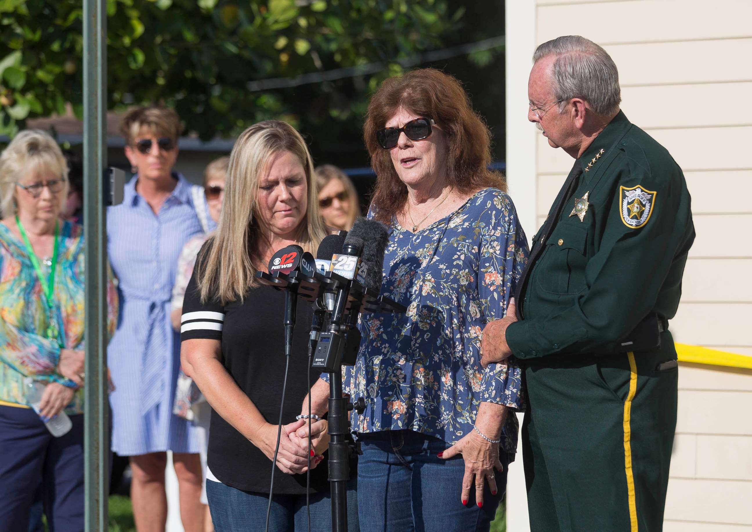 PHOTO: Jennie Johnson, center, talks to the media next to Sheriff Ric Bradshaw after a new lead in the investigation to find her missing daughter, Christy Luna, who disappeared from Greenacres more than 35 years ago, August 5, 2019.