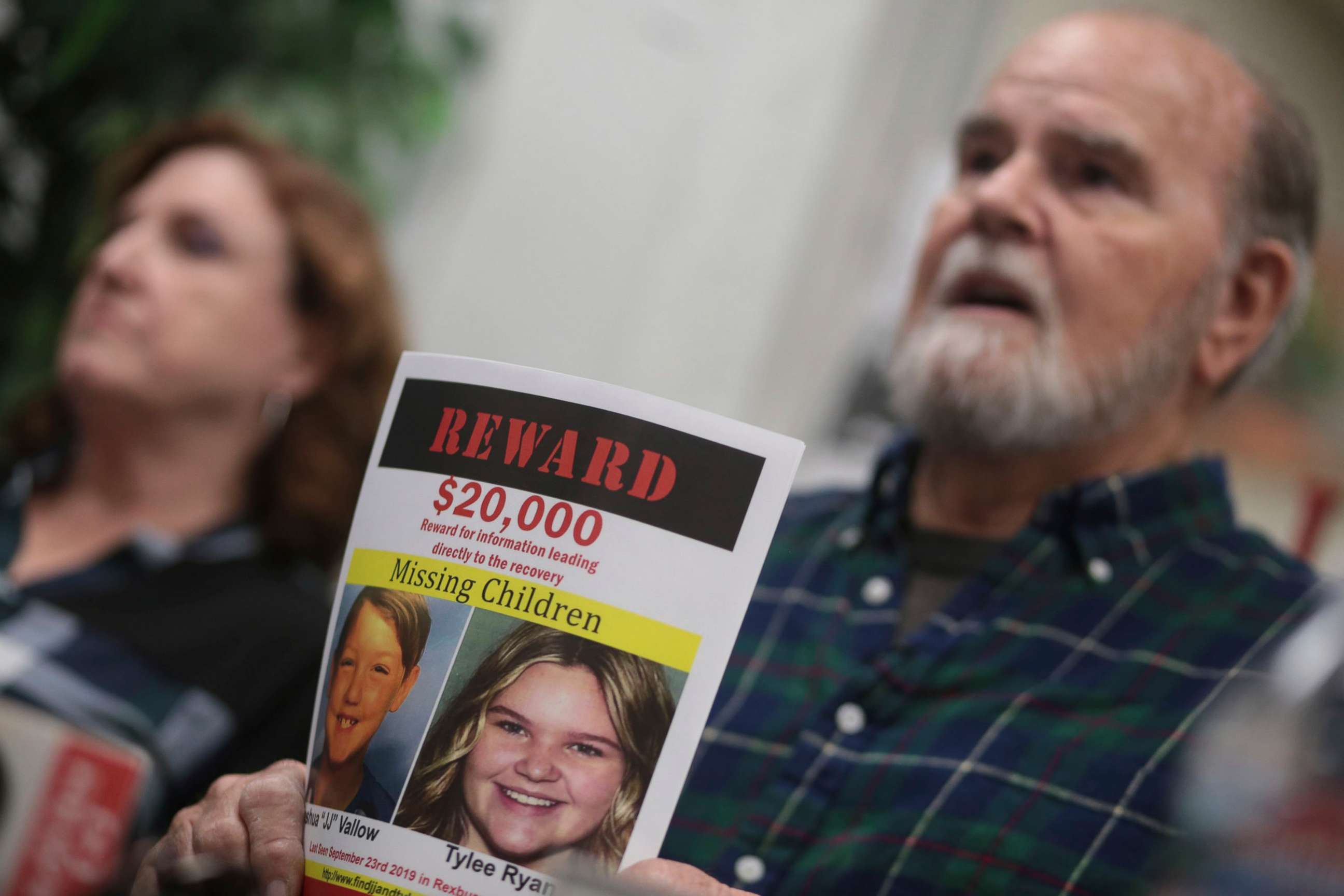 PHOTO: Images of missing children Joshua Vallow and Tylee Ryan are held by Kay and Larry Woodcock as they speak to members of the media in Rexburg, Idaho, Jan. 7, 2020.