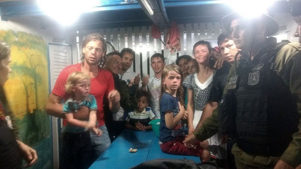 PHOTO: U.S. citizens Adam Harris Harteau, his wife, Emily Faith Harteau and their two children with Brazilian security personnel in Breves, Brazil, Nov. 11, 2017.