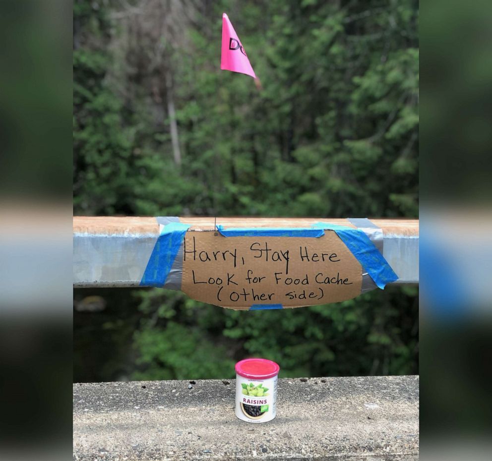PHOTO: A sign and food left for Harry Burleigh, who was reported missing on May 7, 2021, are pictured in a photo released by the Douglas County Sheriff's Office in Oregon.
