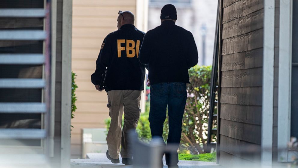 PHOTO: FBI agents canvas the neighborhood searching for information on Heidi Broussard, a missing Austin, Texas, woman and her infant daughter in South Austin, Texas, Dec. 18, 2019.