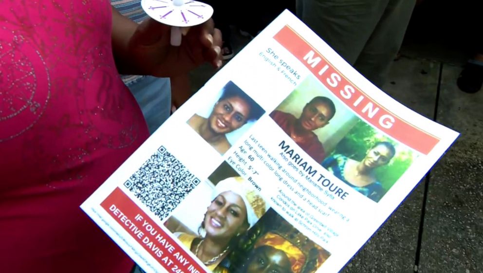 PHOTO: A flyer is handed out at a vigil for missing teacher Mariame Toure Sylla on Aug. 4, 2023.
