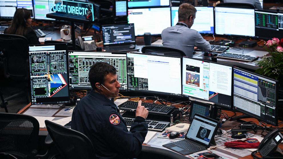 PHOTO: Artemis II controllers monitor the progress of the Orion spacecraft in the White Flight Control Room at Johnson Space Center in Houston, Texas, on April 3, 2026. 