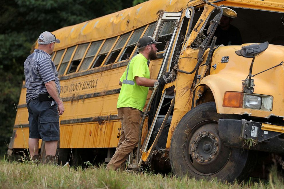 PHOTO: Wrecker crews inspect the damage to a Benton County School bus that was involved in wreck along U.S. Highway 72 near Walnut, Miss., Sept. 10, 2019.