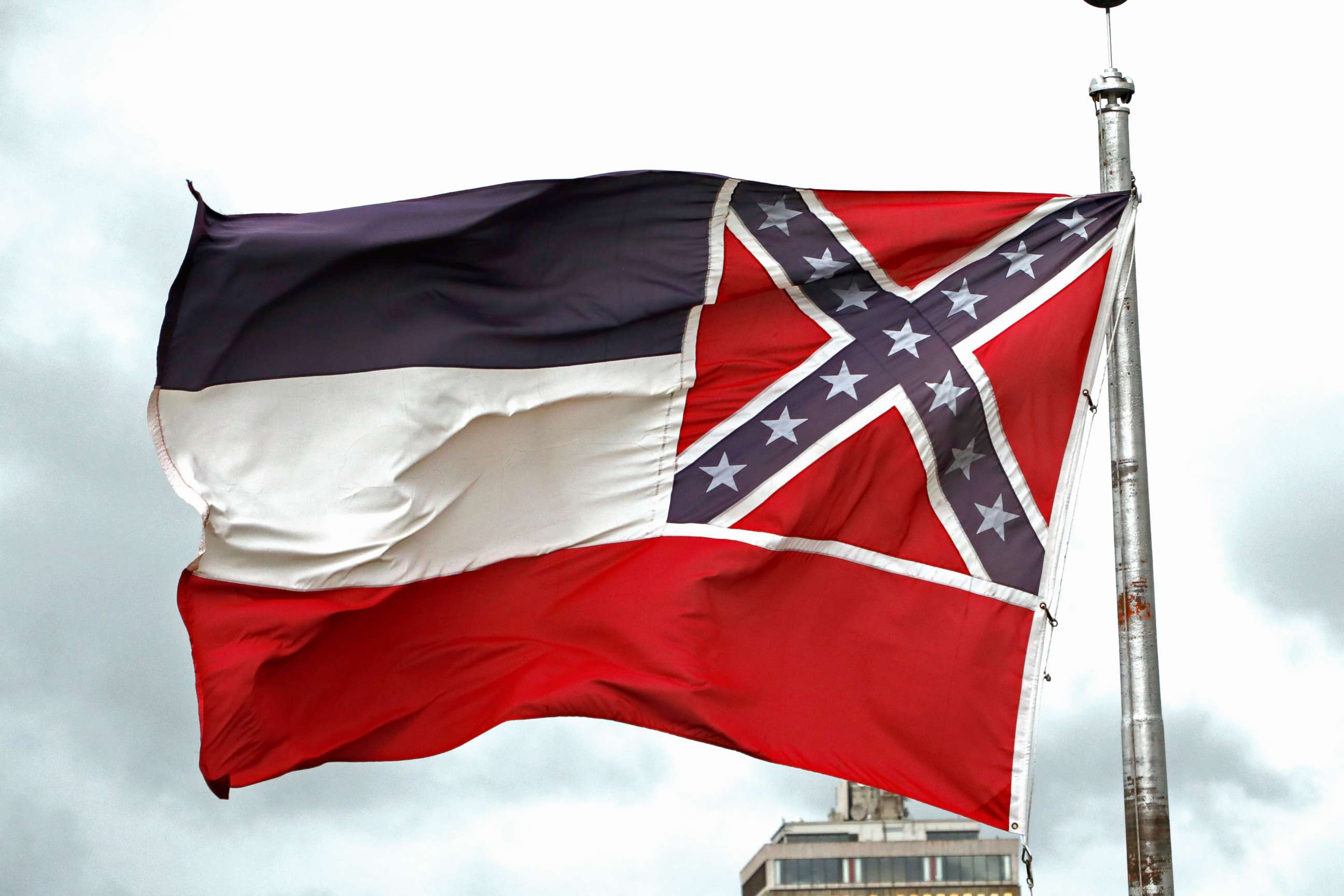 PHOTO: This June 25, 2020, file photo shows a Mississippi state flag flying outside the Capitol in Jackson, Miss. 