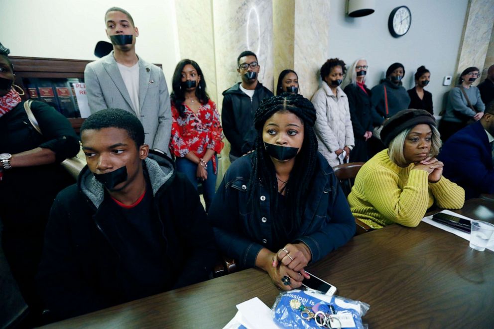 PHOTO: Prison reform advocates wear strips of tape across their mouths as a silent protest during a hearing of the House Corrections and Judiciary B Committees to address current corrections issues, Feb. 13, 2020, at the Capitol in Jackson, Miss.