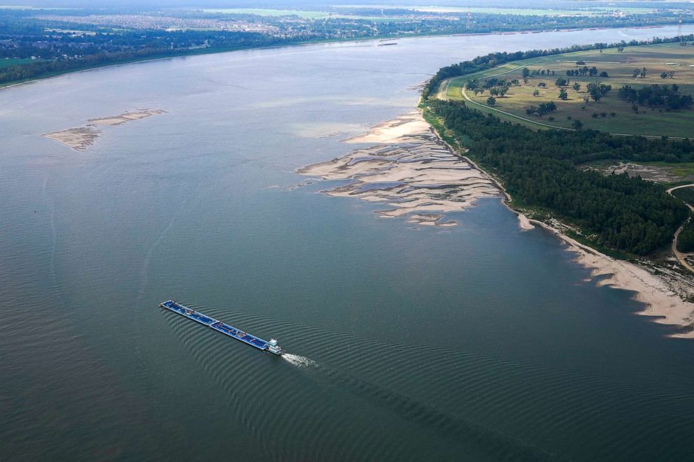 PHOTO: In this aerial photo, a tugboat pushing barges navigates between and around sandbars during low water levels on the Mississippi River between Baton Rouge, La., and Reserve, La. in Livingston Parish, La., on Sept. 14, 2023.