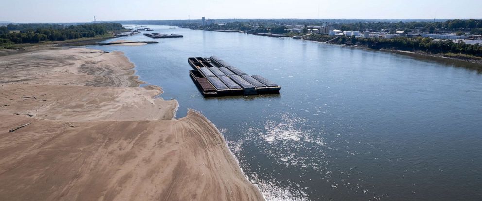 PHOTO: Barges float in the Mississippi River as a portion of the riverbed is exposed, on Sept. 15, 2023, in St. Louis.