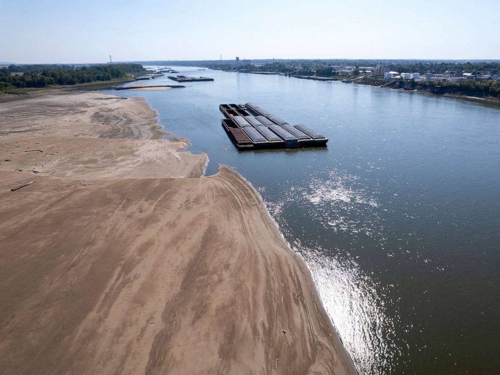 PHOTO: Barges float in the Mississippi River as a portion of the riverbed is exposed, on Sept. 15, 2023, in St. Louis.