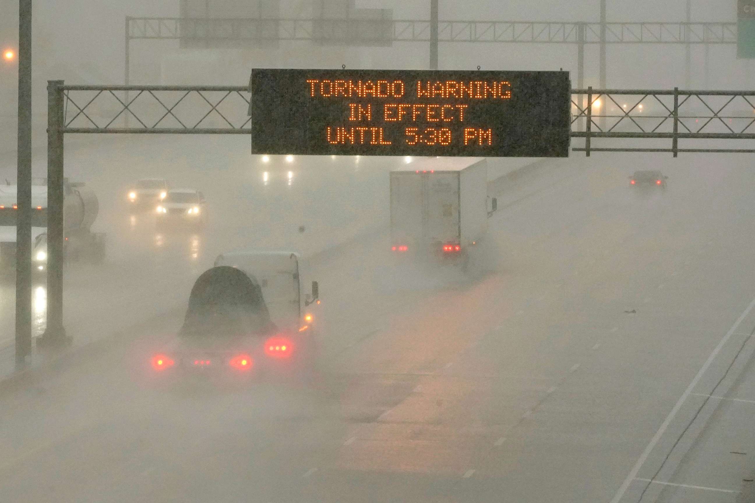 PHOTO: The Mississippi Department of Transportation digital message board warns drivers along I-55 southbound of a tornado warning during a rainstorm in Jackson, Miss., March 30, 2022.