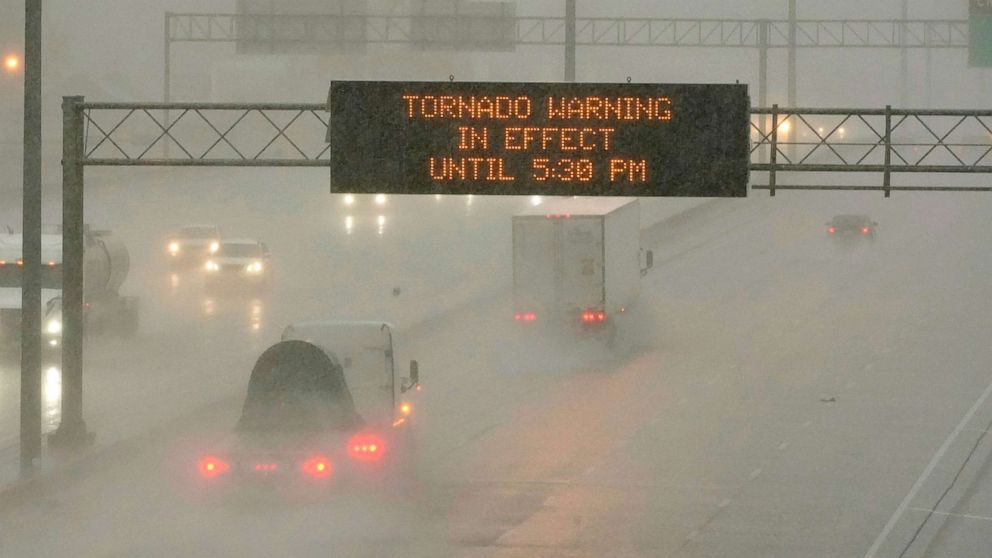 PHOTO: The Mississippi Department of Transportation digital message board warns drivers along I-55 southbound of a tornado warning during a rainstorm in Jackson, Miss., March 30, 2022.