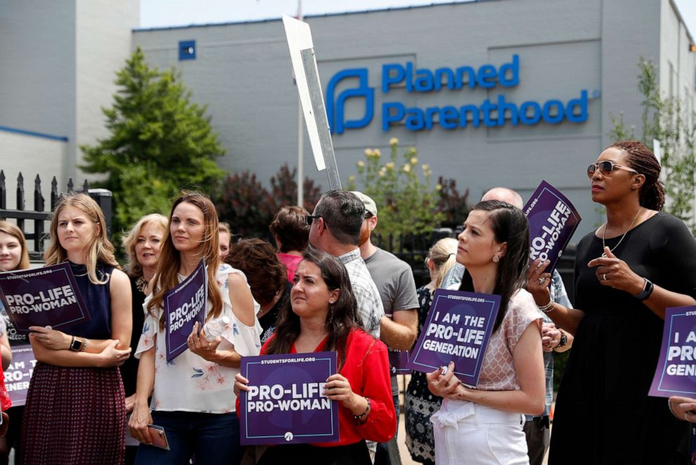 PHOTO: In this June 4, 2019, file photo, anti-abortion advocates gather outside the Planned Parenthood clinic in St. Louis.