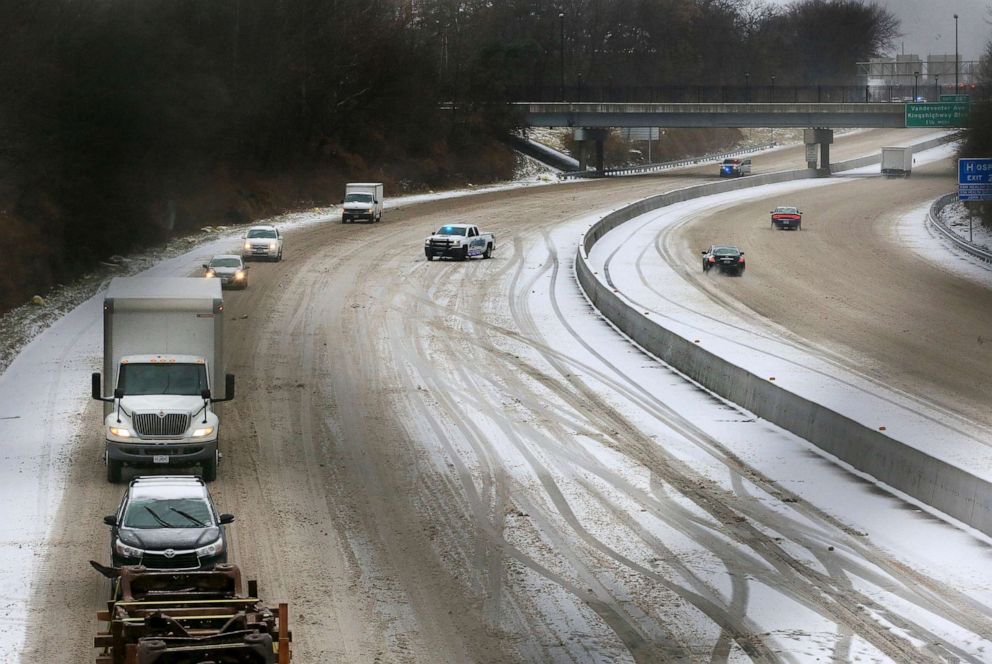 PHOTO: Emergency vehicles block off the the left lanes of Interstate 44 East where a semi truck crashed into an overpass during a snowy morning, Feb. 2, 2022.