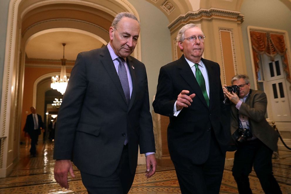 PHOTO: Senate Minority Leader Charles Schumer and Senate Majority Leader Mitch McConnell walk side-by-side to the Senate Chamber at the U.S. Capitol Feb. 7, 2018, in Washington.
