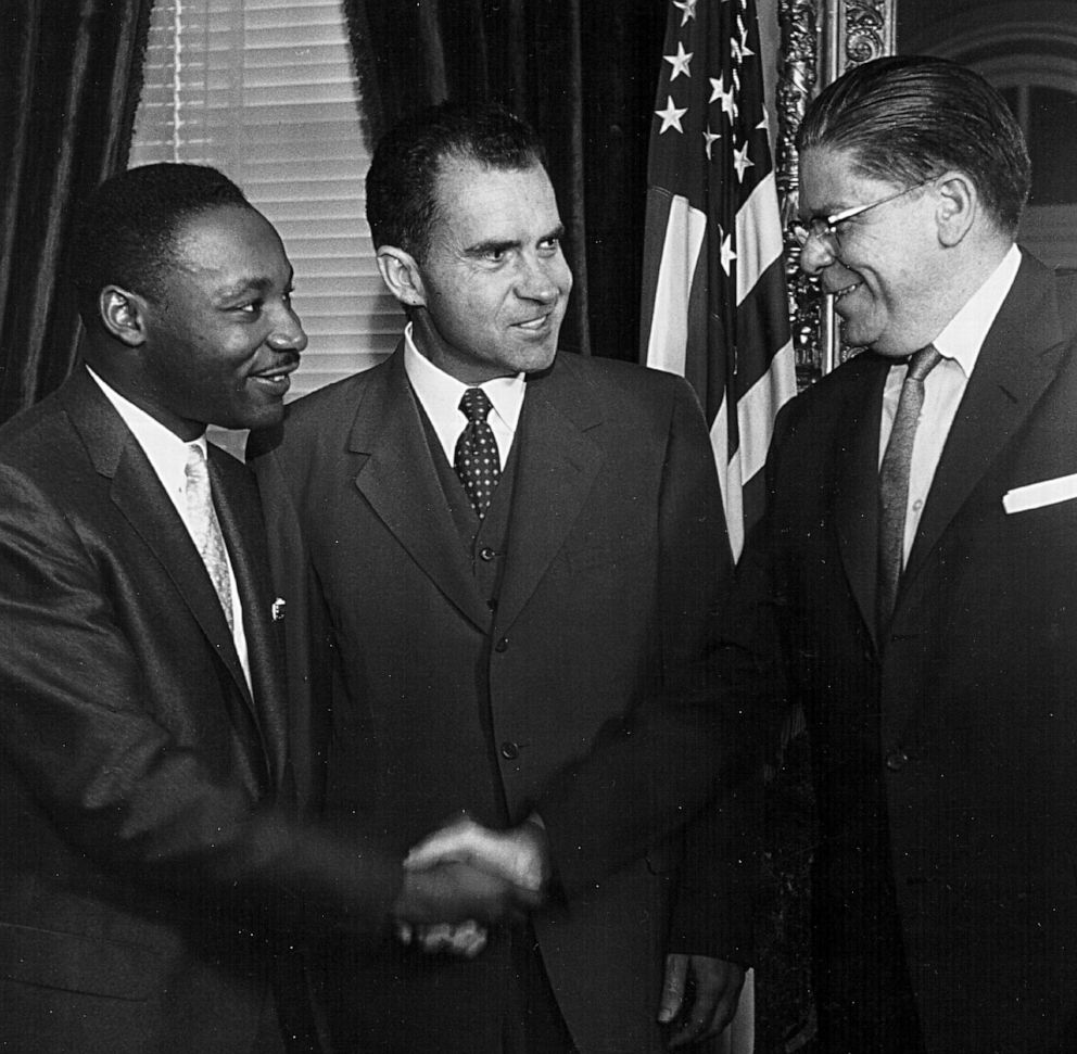 PHOTO: Secretary of Labor James P. Mitchell, right, shakes hands with Rev. Martin Luther King as Vice President Richard Nixon looks on Aug. 8, 1957 in Washington.