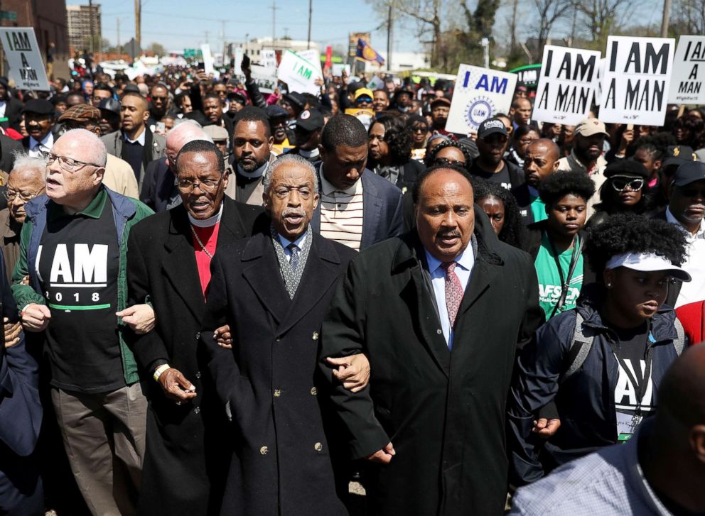 Rev. Al Sharpton (C), Bishop Charles Blake (2nd L) and Martin Luther King III (2nd R) lead a march on the anniversary of the assassination of Martin Luther King, Jr., April 4, 2018 in Memphis, Tenn.