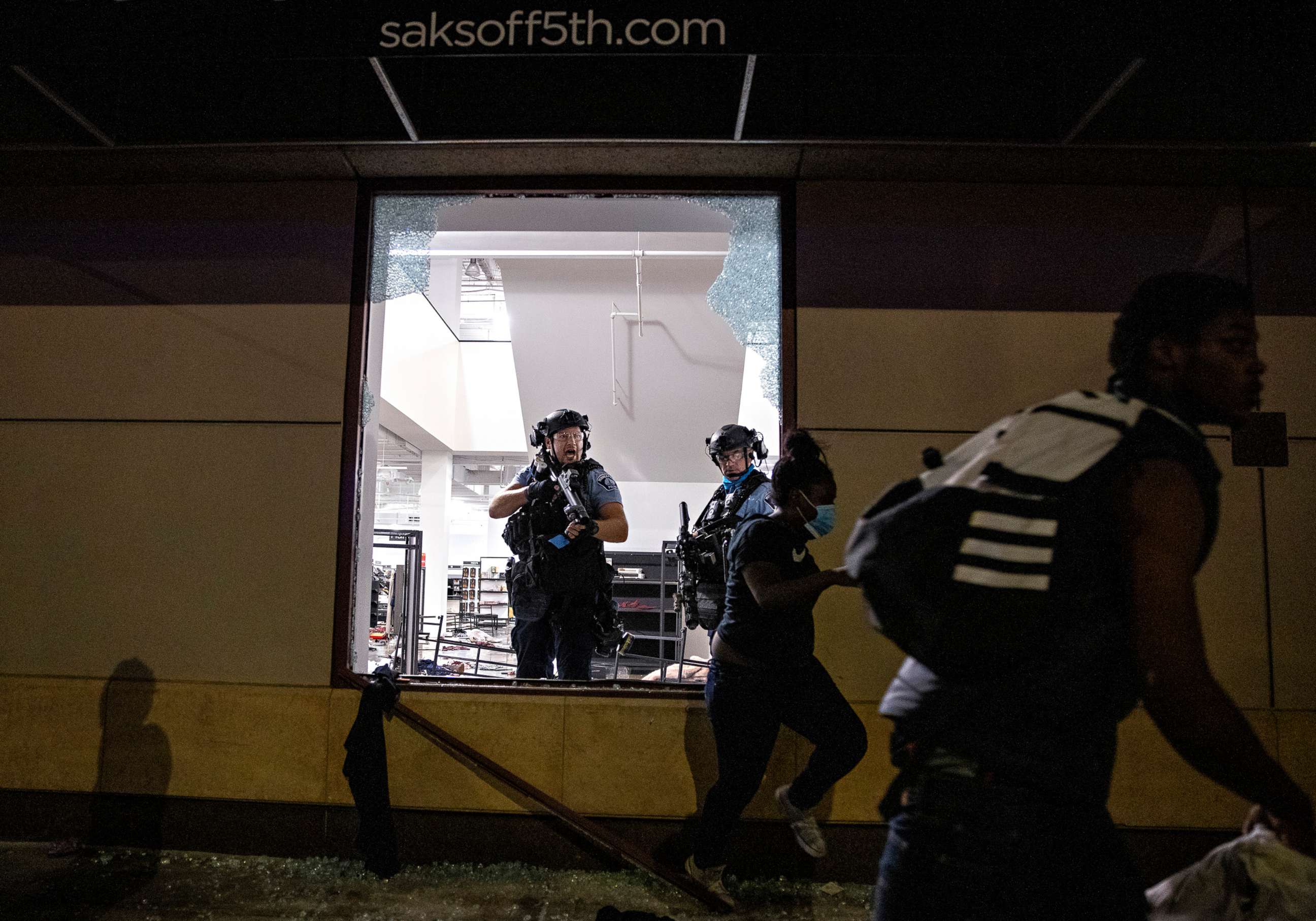 PHOTO: Police clear out and secure Saks OFF 5th after people broke in on Aug. 26, 2020, in Minneapolis.