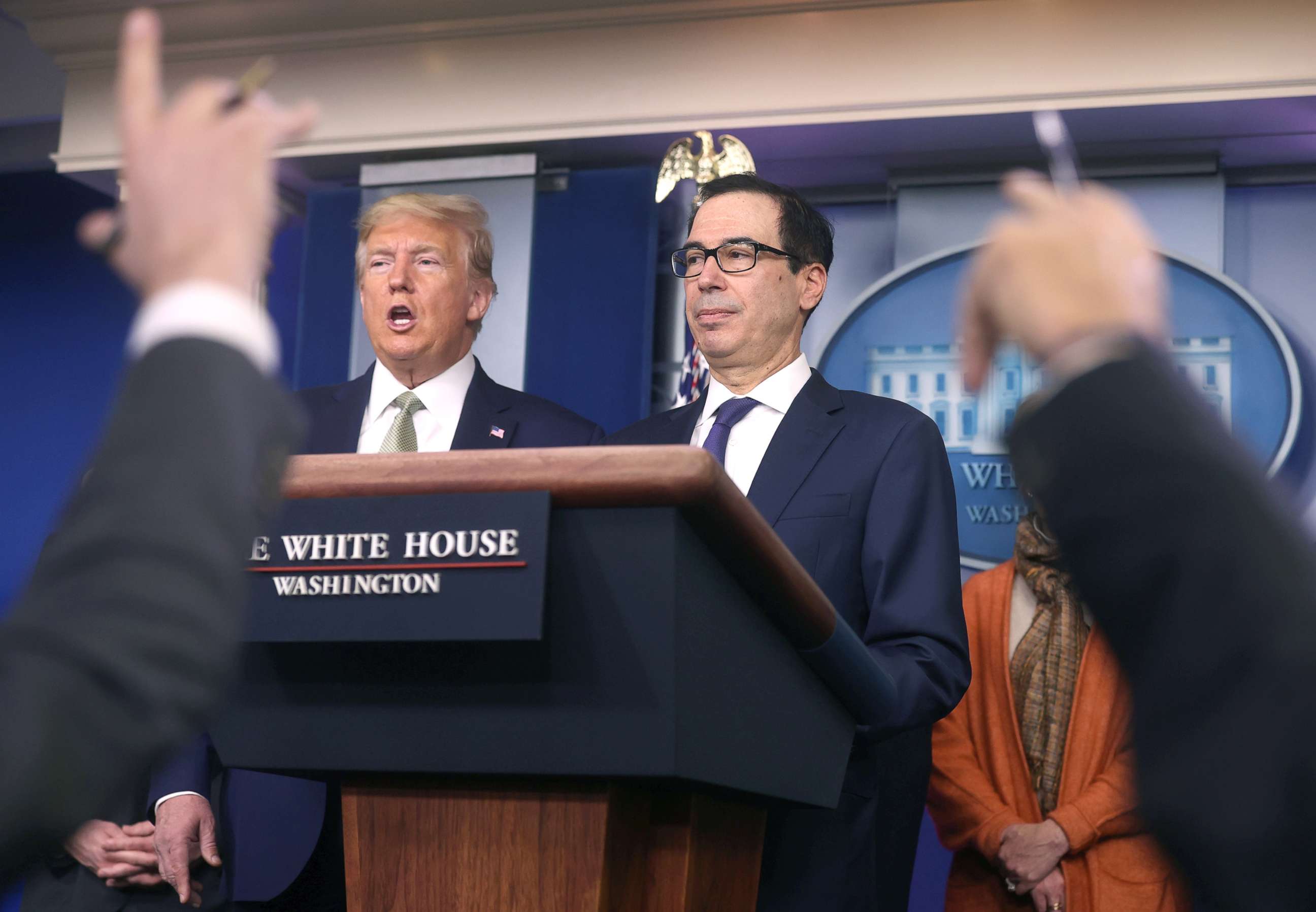 PHOTO: President Donald Trump and Treasury Secretary Steven Mnuchin answer questions during the  daily coronavirus briefing at the White House, March 17, 2020. 