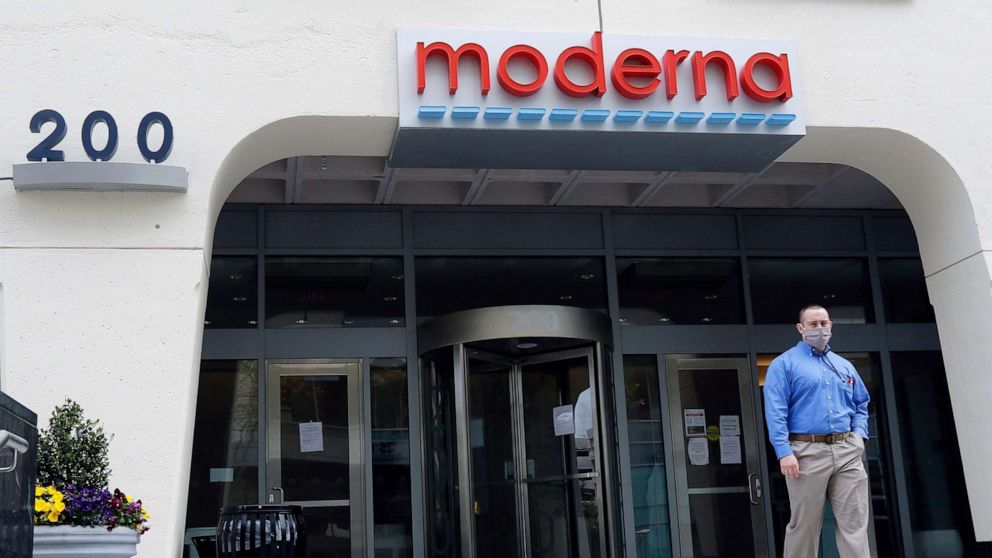 PHOTO: A man stands outside an entrance to a Moderna, Inc., building, Monday, May 18, 2020, in Cambridge, Mass.