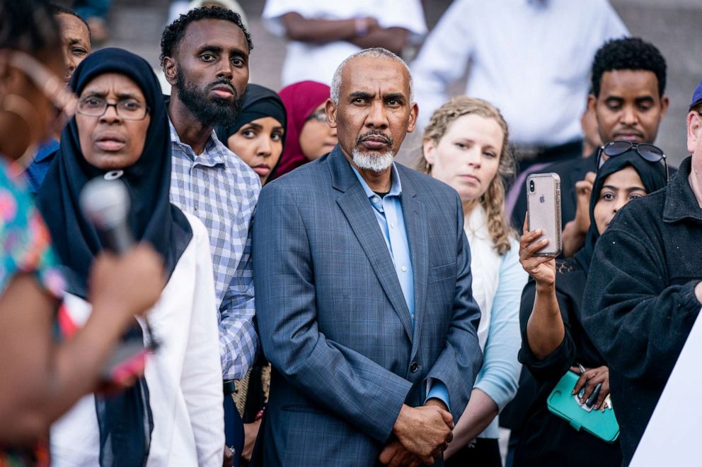 PHOTO: Mohamed Noor's father, Mohamed Abass, center, attends a rally in support of the former Minneapolis police officer Thursday, June 6, 2019, in Minneapolis.