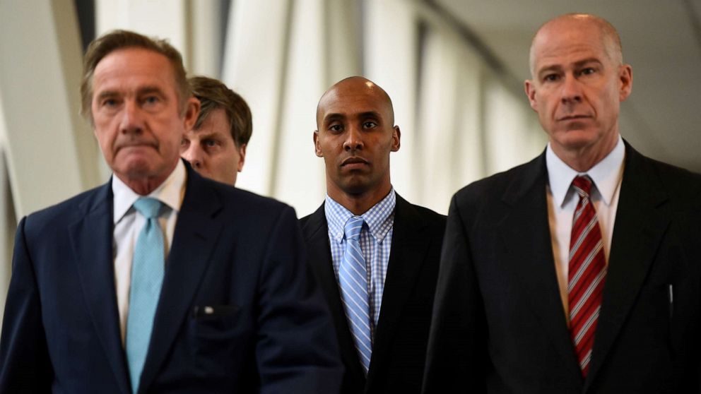 PHOTO: Mohamed Noor, center, former Minnesota policeman on trial for fatally shooting an Australian woman, walks into the courthouse in Minneapolis, Minnesota, April 30, 2019.