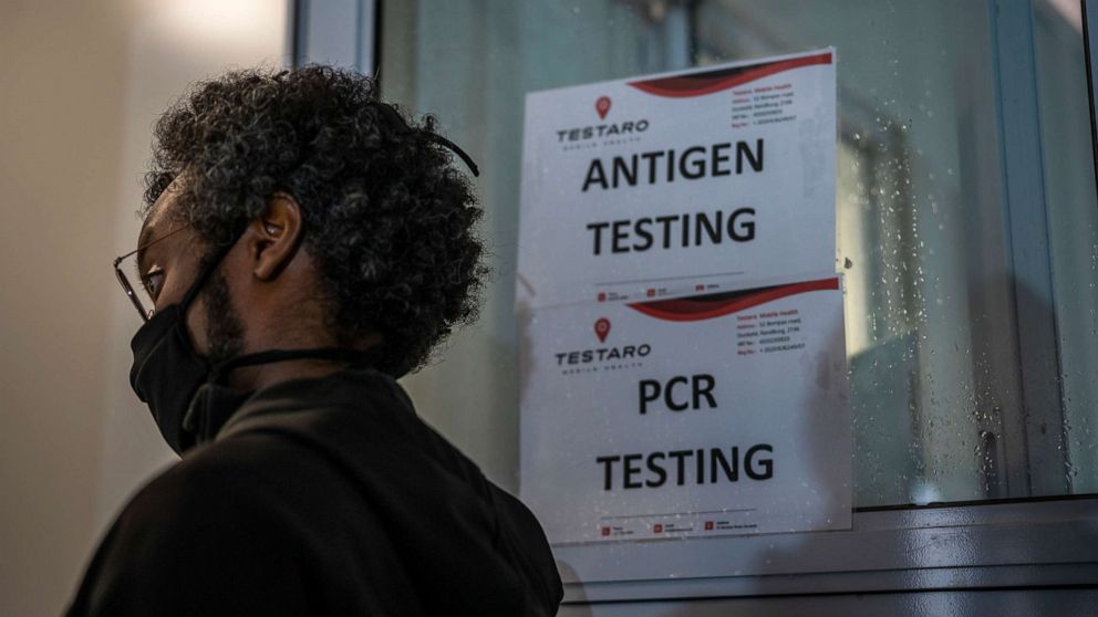 PHOTO: A person queues to be tested for COVID-19 in Johannesburg, South Africa, Saturday Nov. 26, 2021. 