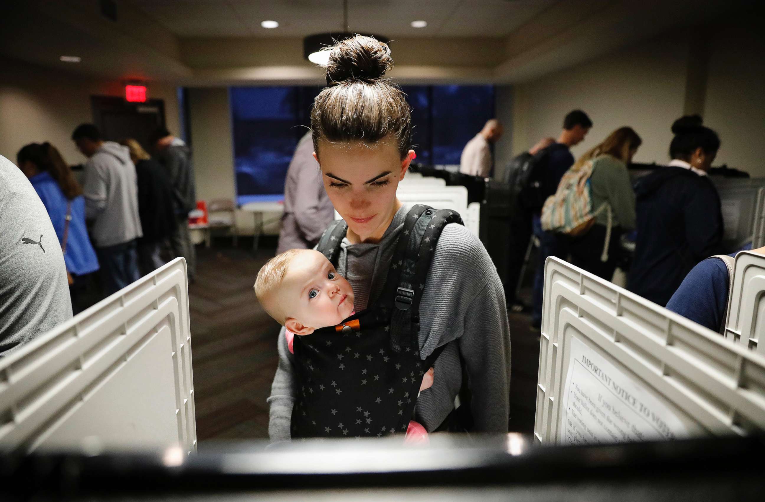 PHOTO: Kristen Leach votes with her daughter, Nora, on election day in Atlanta,  Nov. 6, 2018.