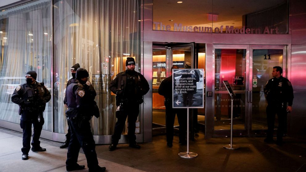 PHOTO: Members of the New York City Police Department gather at the entrance of the Museum of Modern Art after an alleged multiple stabbing incident, in New York, March 12, 2022. 