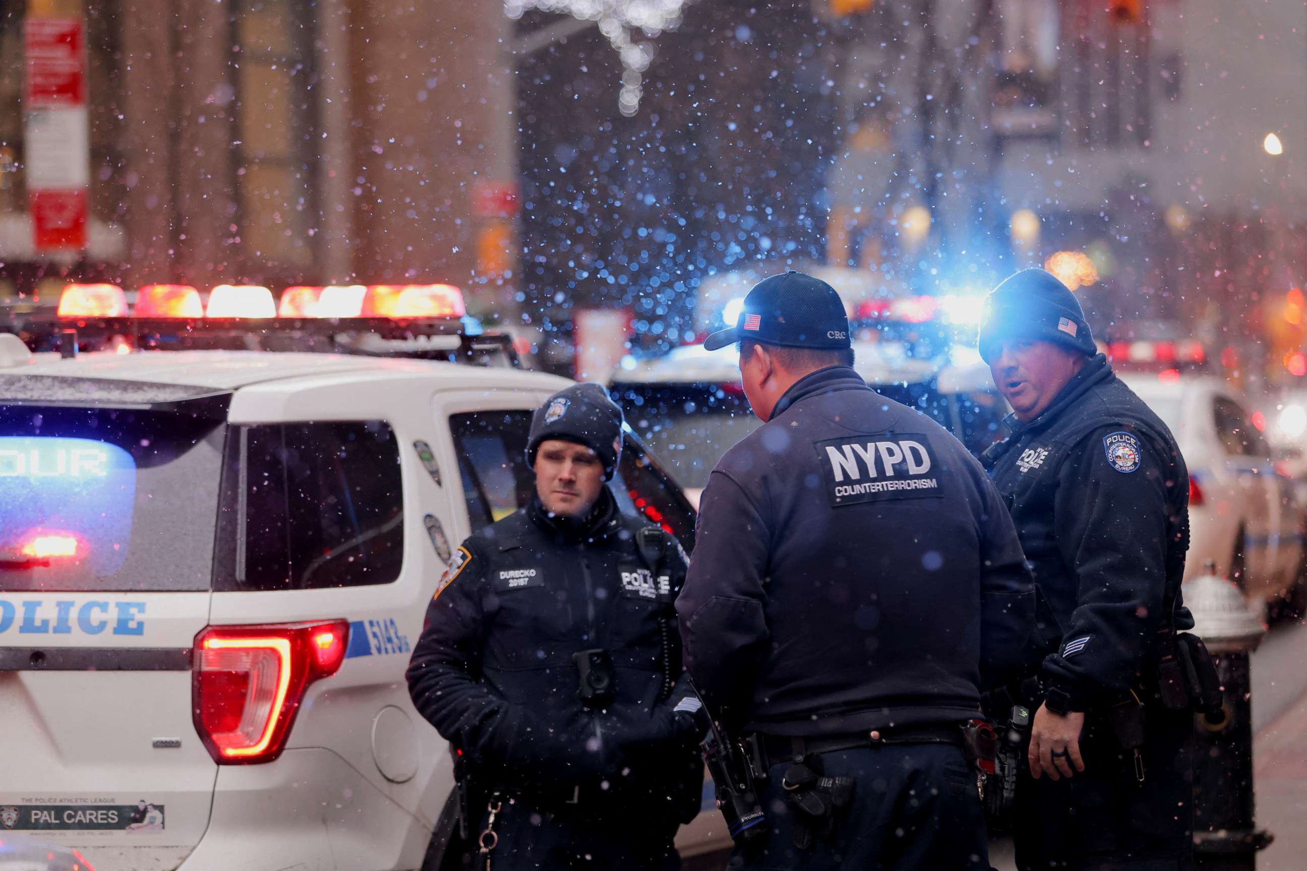PHOTO: Members of the New York City Police Department gather at the entrance of the Museum of Modern Art after an alleged multiple stabbing incident, in New York, March 12, 2022.