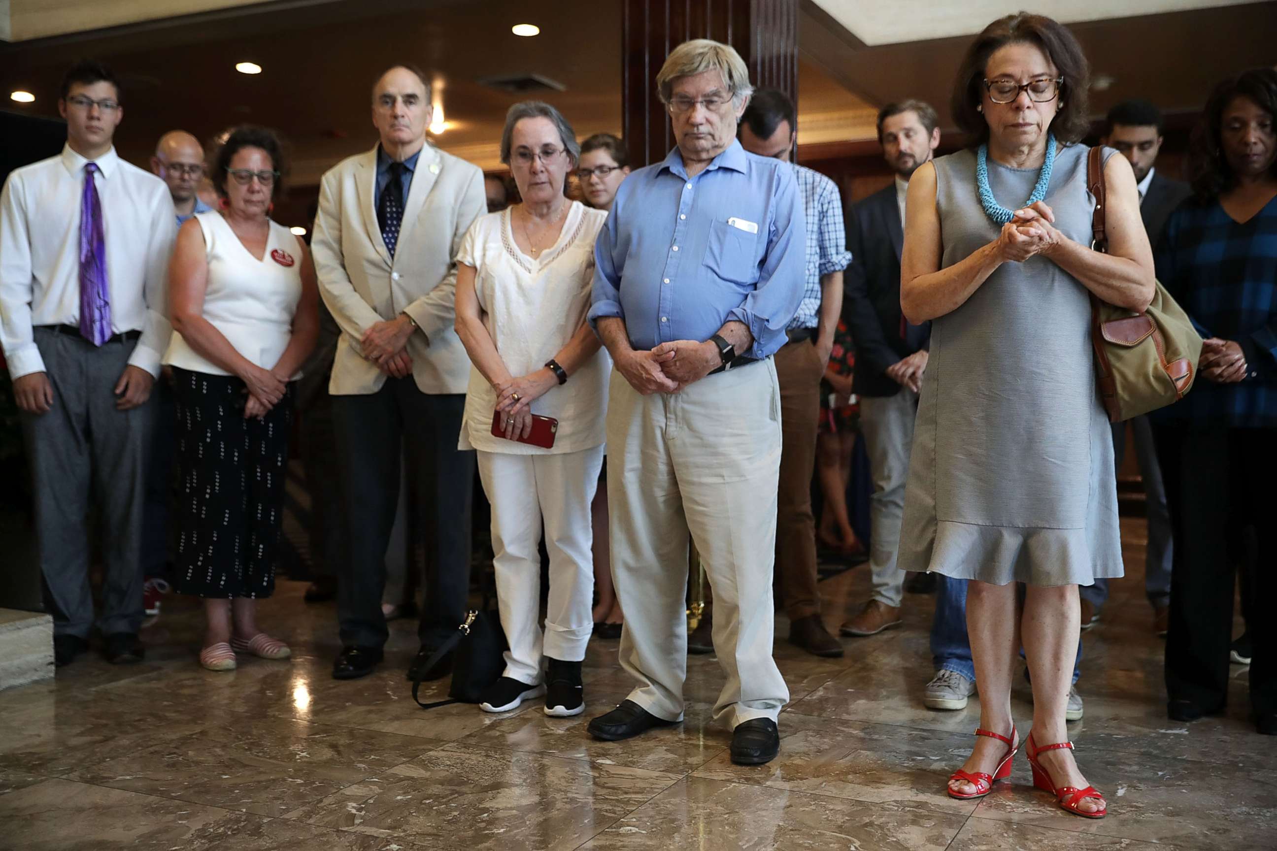 PHOTO: Members and guests of the National Press Club observe a moment of silence to honor the victims of last week's shooting at the Annapolis Capital Gazette newspaper July 5, 2018 in Washington, DC.