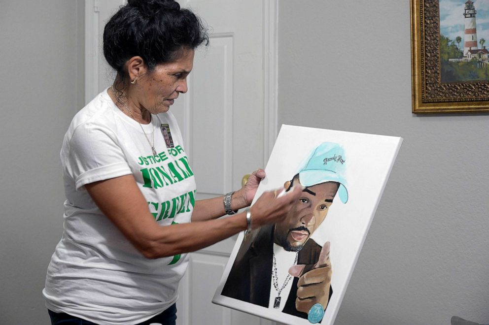 PHOTO: Mona Hardin recounts the events surrounding the death of her son, Ronald Greene, as she holds a painting of him in Orlando, Fla., on Dec. 4, 2021.