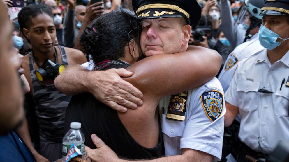 PHOTO: Chief of Department of the New York City Police, Terence Monahan, hugs an activist during a protest in New York, June 1, 2020. 