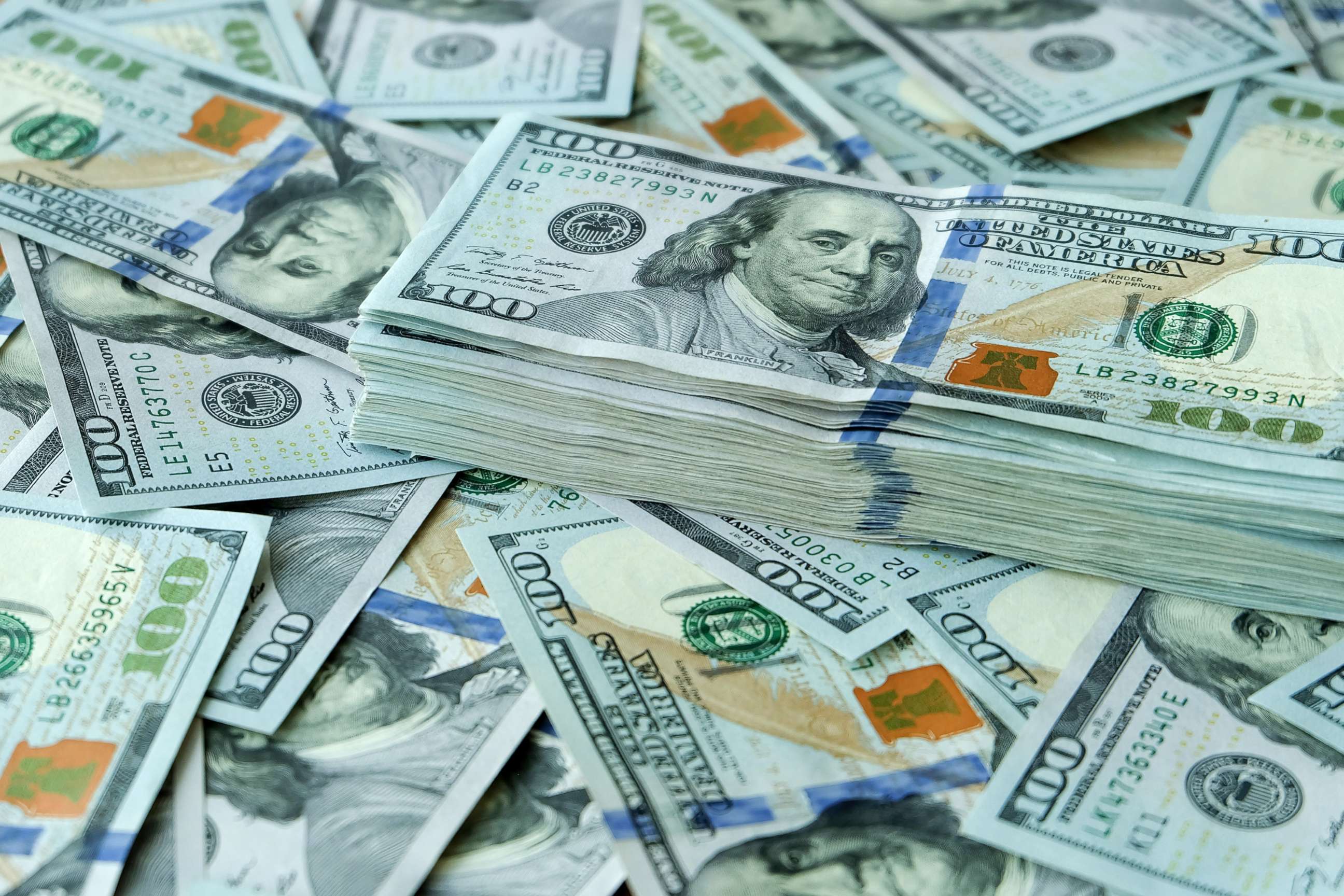 PHOTO: Stacks of 100 dollar bills.