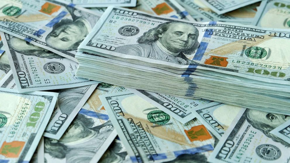 PHOTO: Stacks of 100 dollar bills.
