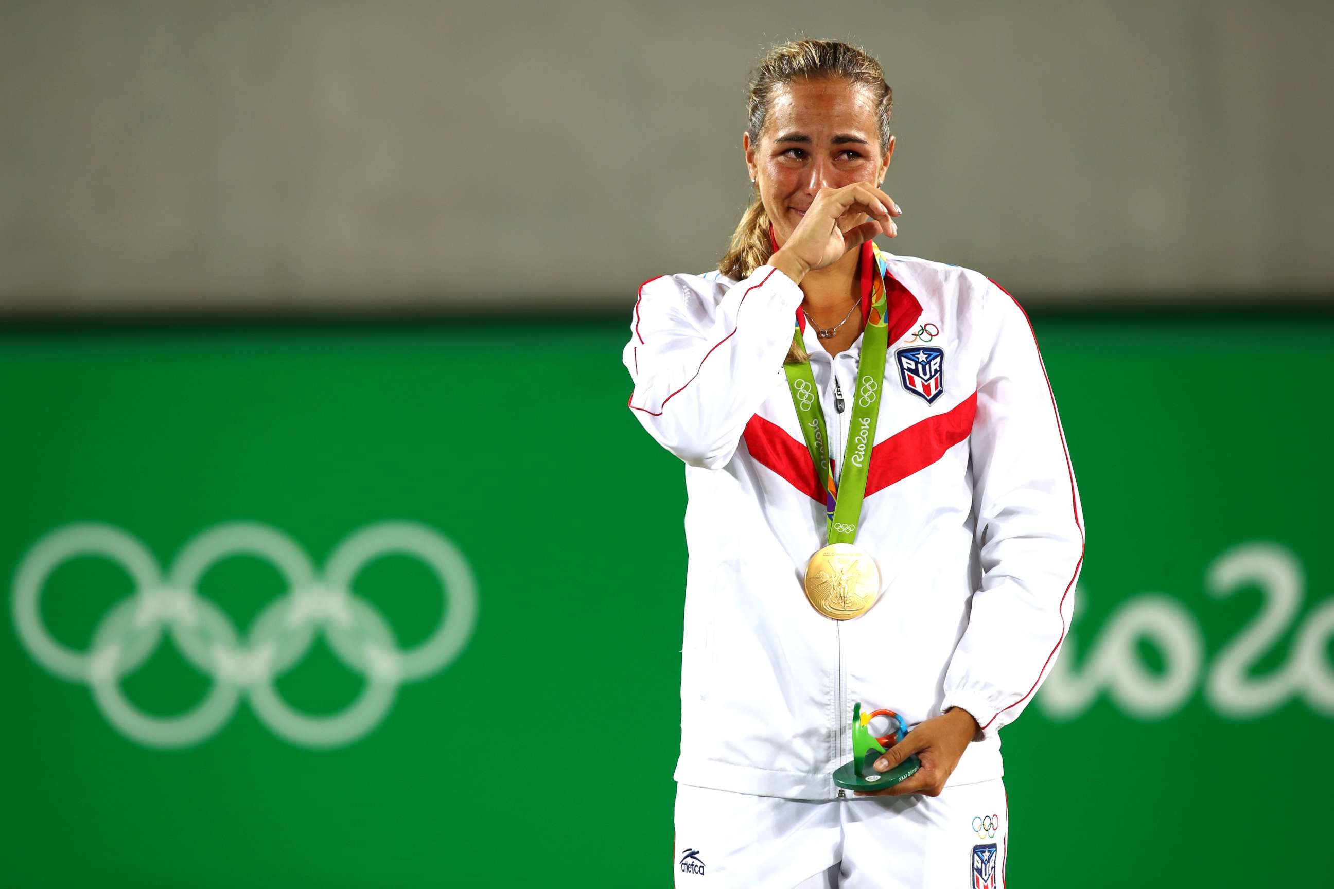 PHOTO: Gold medalist Monica Puig of Puerto Rico reacts during the medal ceremony for the Women's Singles Gold Medal Match on Day 8 of the Rio 2016 Olympic Games at the Olympic Tennis Centre, Aug. 13, 2016, in Rio de Janeiro, Brazil.