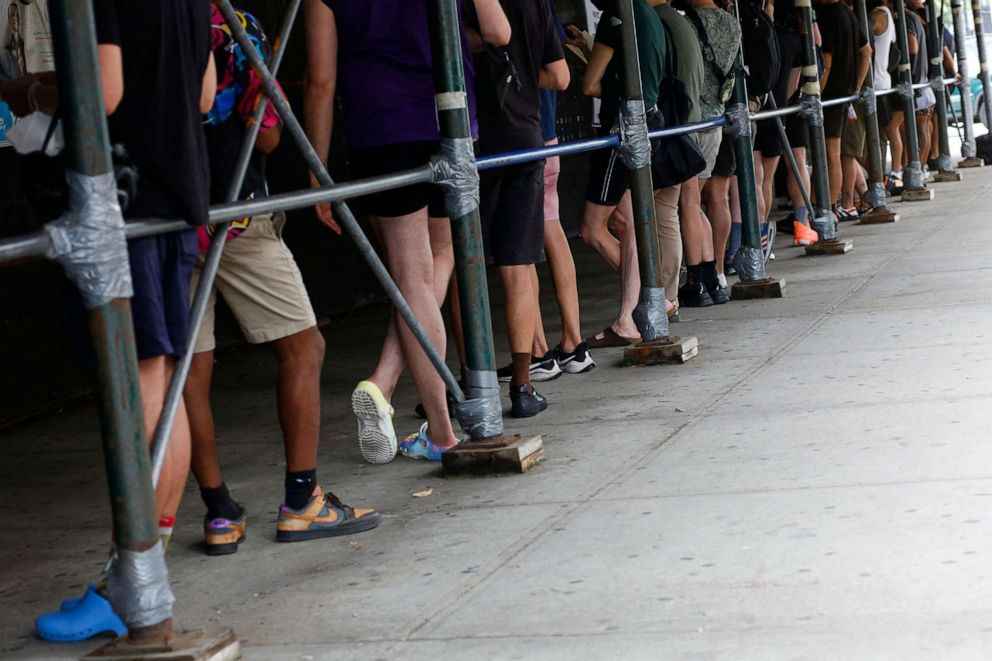 PHOTO: People wait in line to recieve the Monkeypox vaccine before the opening of a new mass vaccination site at the Bushwick Education Campus in Brooklyn on July 17, 2022.