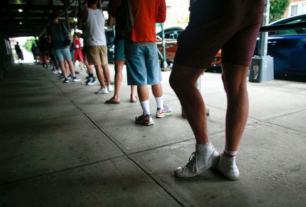 PHOTO: People wait in line to recieve the Monkeypox vaccine at the Bushwick Education Campus in Brooklyn on July 17, 2022, in New York City.