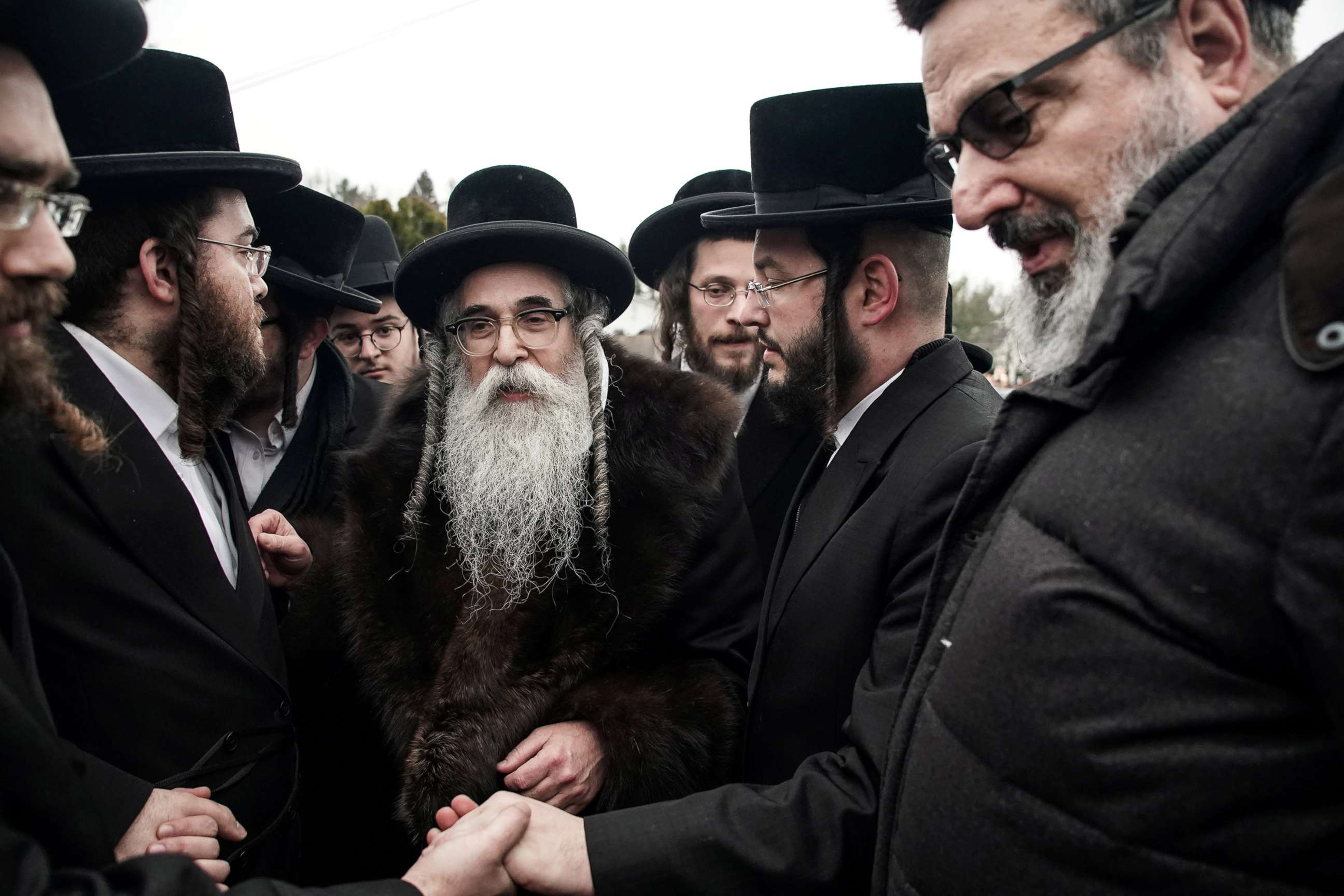 PHOTO: Rabbi Chaim Rottenberg shakes hands with people in Monsey, New York, Dec. 29, 2019. 