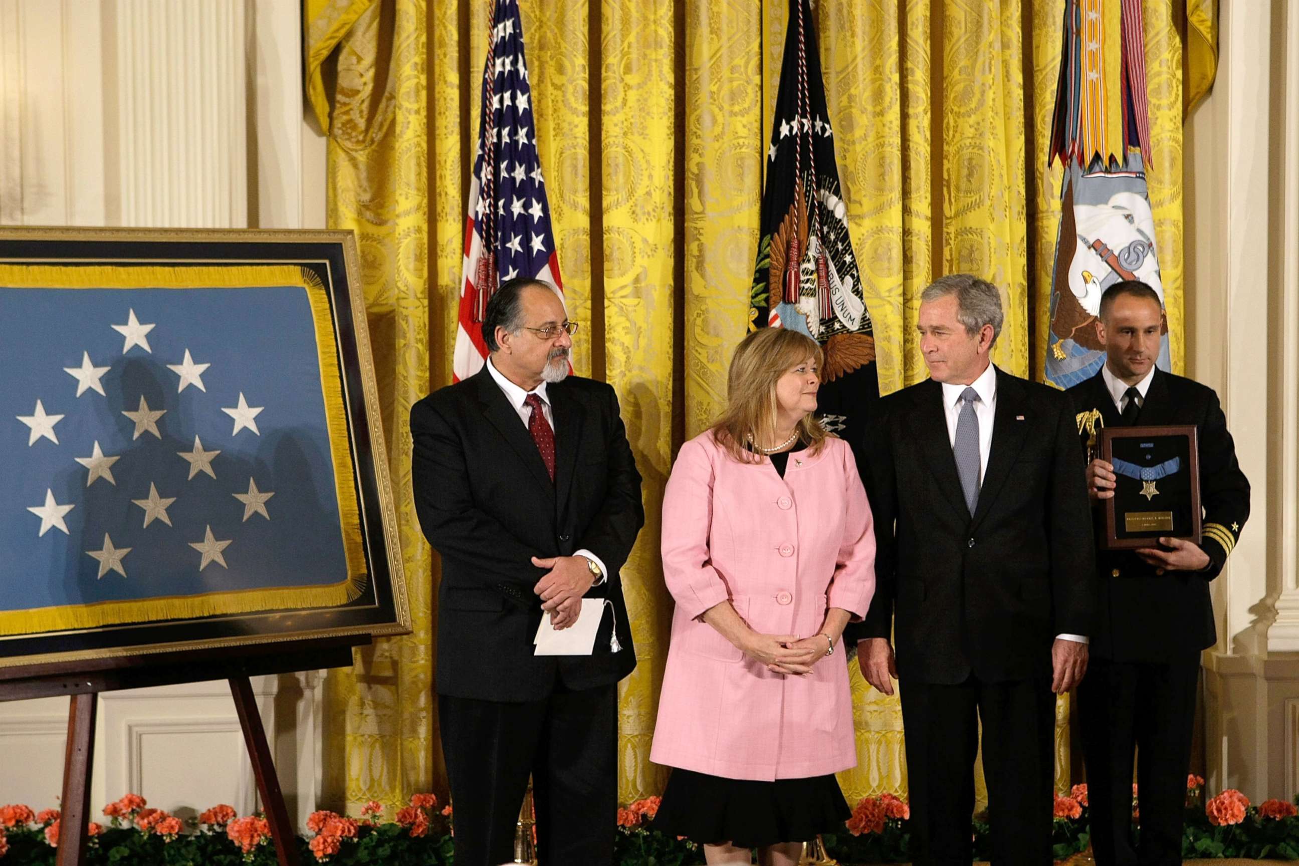 PHOTO: President George W. Bush shares a moment with Sally Monsoor and George Monsoor during a ceremony to receive the Medal of Honor on behalf of their son Petty Officer 2nd Class Michael Monsoor, April 8, 2008, at the White House.