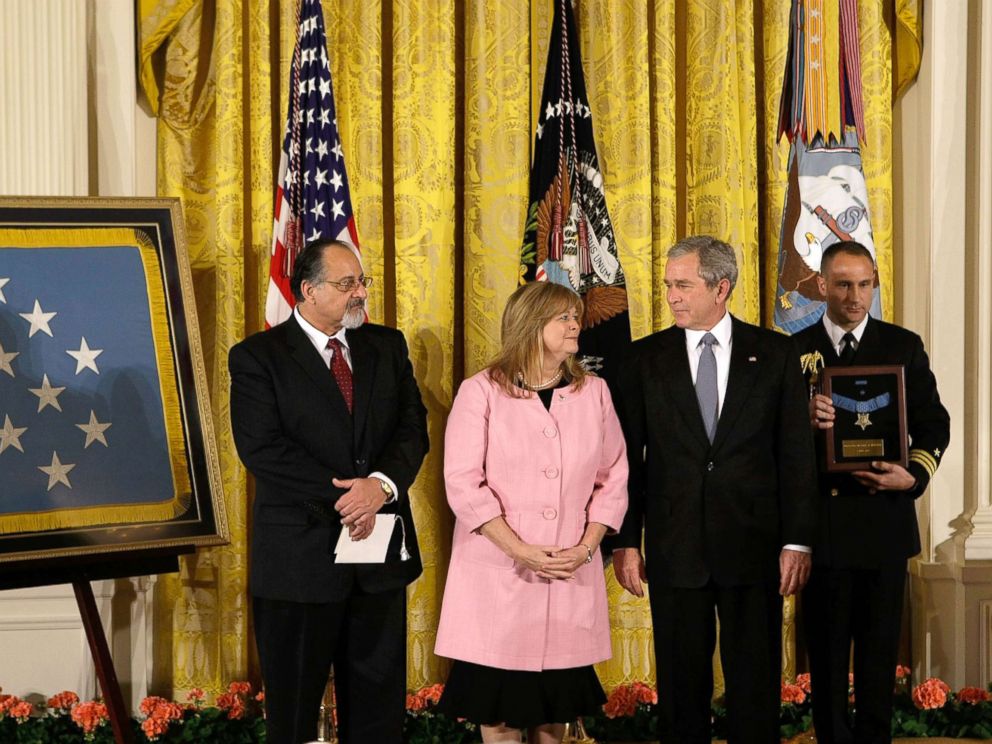PHOTO: President George W. Bush shares a moment with Sally Monsoor and George Monsoor during a ceremony to receive the Medal of Honor on behalf of their son Petty Officer 2nd Class Michael Monsoor, April 8, 2008, at the White House.