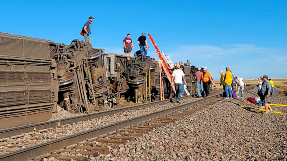 PHOTO: In this photo provided by Kimberly Fossen people work at the scene of an Amtrak train derailment on Saturday, Sept. 25, 2021, in north-central Montana.