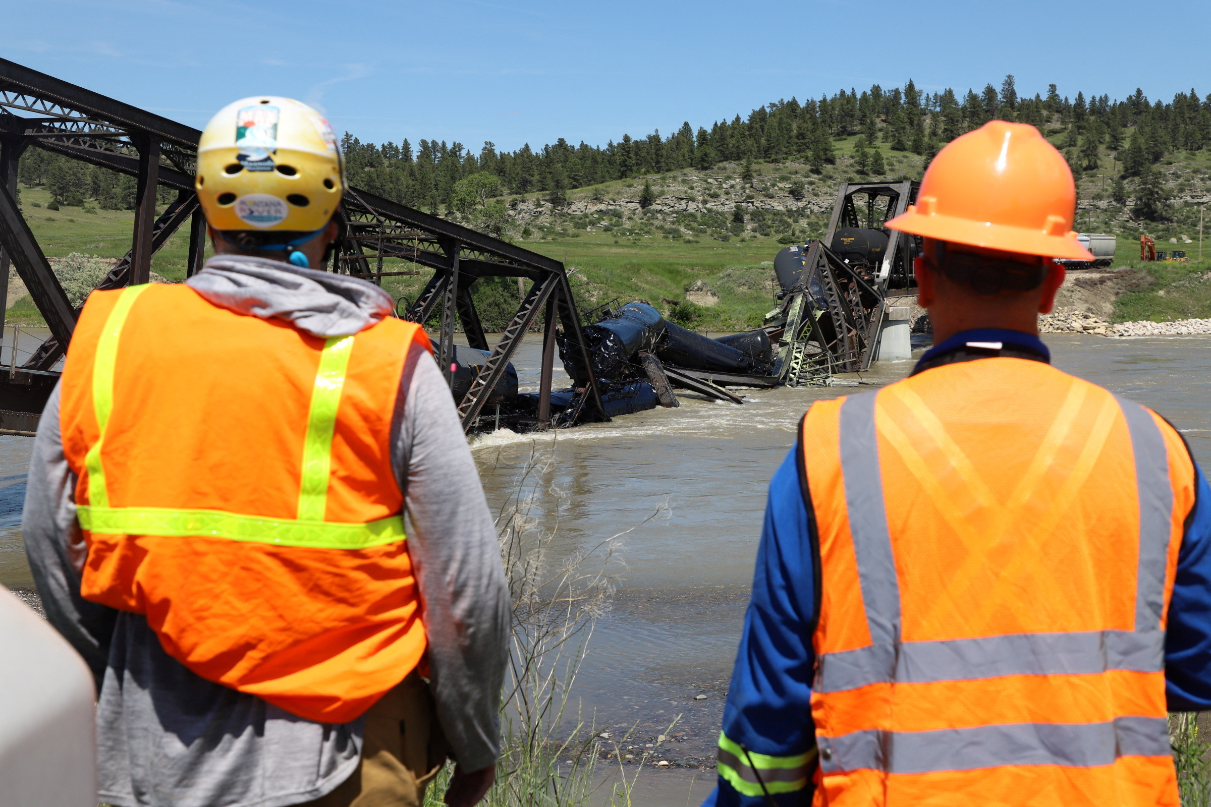 PHOTO: A crew works at the site of a train derailment inside Yellowstone River waters following the collapse of a bridge near Colombus, Montana, as seen in this screen grab from a video released on June 25, 2023.