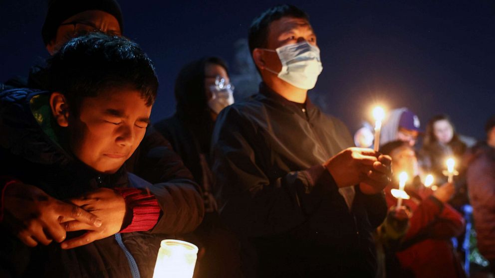 PHOTO: People gather at a candlelight vigil for victims of a deadly mass shooting at a ballroom dance studio, Jan. 23, 2023 in Monterey Park, Calif.