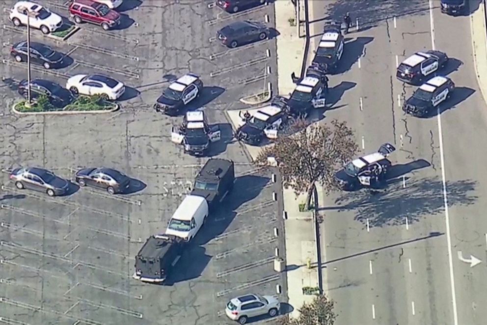 PHOTO: Police use armored vehicles to surround a white cargo van, believed by law enforcement to be connected to the Monterey Park shooting suspect according to an ABC affiliate, at a parking lot in Torrance, Calif., Jan. 22, 2023 in a video screengrab.