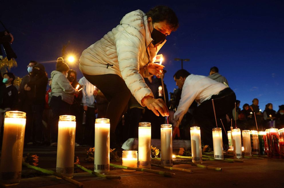 PHOTO: MONTEREY PARK, CALIFORNIA - JANUARY 25: People attend a candlelight vigil at the growing memorial outside the Star Ballroom Dance Studio where a deadly mass shooting took place on January 25, 2023 in Monterey Park, California.