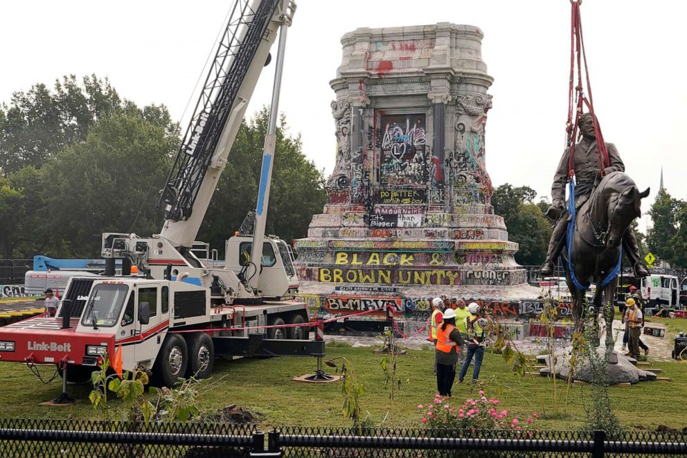 PHOTO: Crews remove a statue of Confederate General Robert E. Lee on Monument Avenue, Sept. 8, 2021 in Richmond, Va.